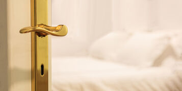Hotel's,Blurred,Bedroom,From,Opened,Door.,White,Background,,Close,Up